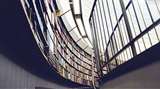 photo of huge book shelf inside book store or library.